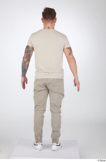 Gilbert beige t-shirt beige trousers casual dressed standing white sneakers…